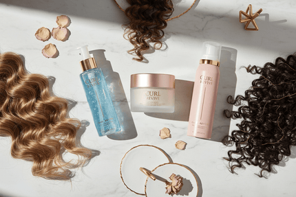 best curl products for curly hair displayed on a marble surface